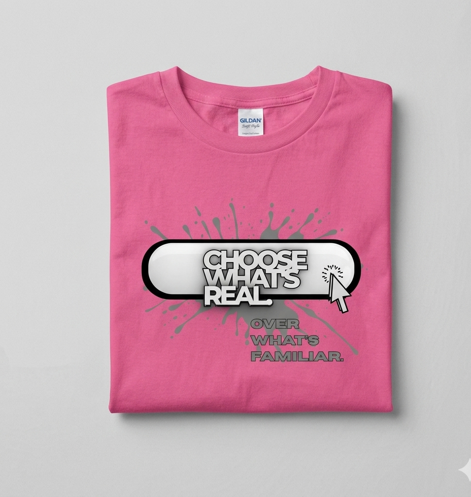 Pink t-shirt with motivational quote graphic on a gray background
